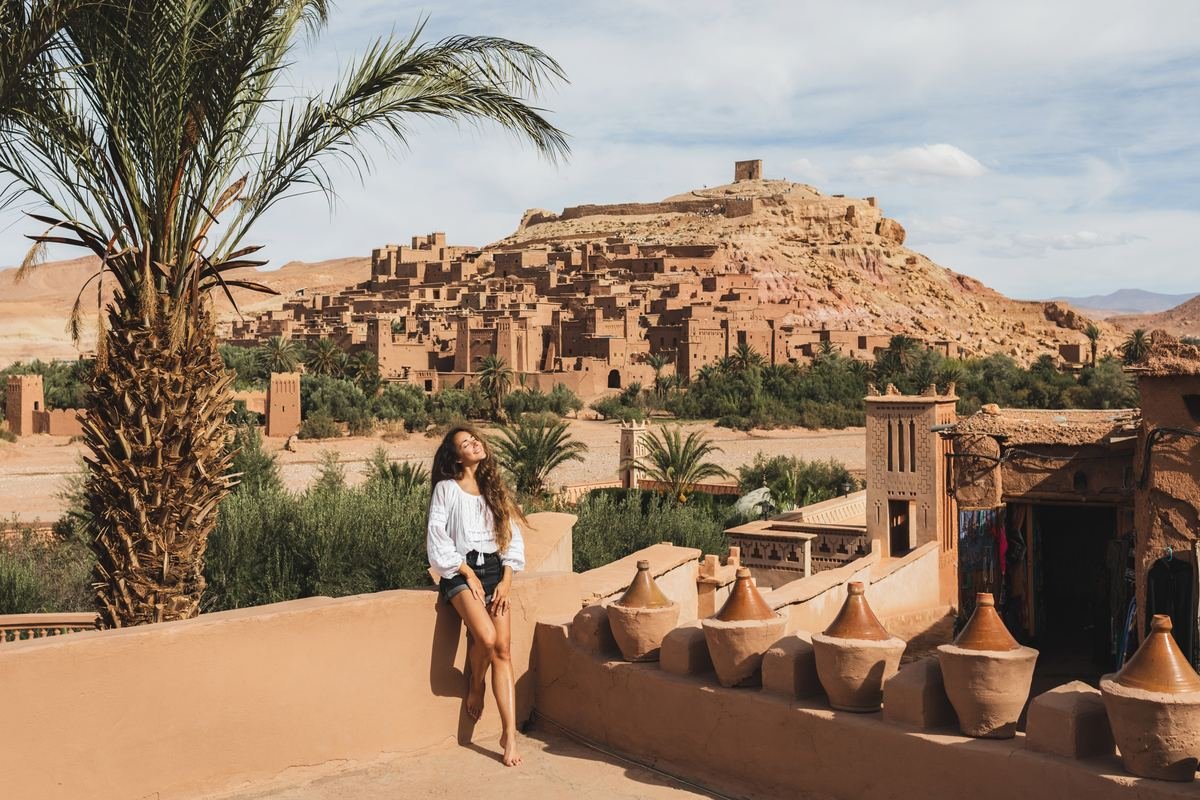 Traveller on a terrace looking at the ksar of Ait Benhaddou